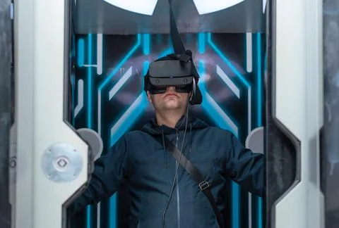 Man using virtual or augmented reality glasses. Concept of modern lifestyle and Stock Photos