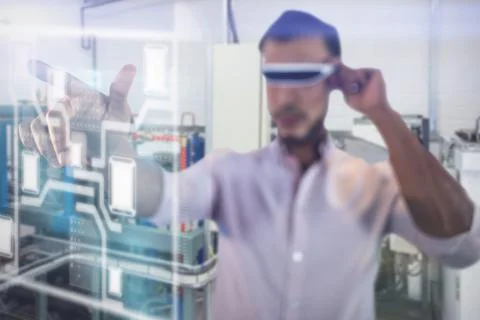 Man using a virtual reality device against workshop 스톡 사진