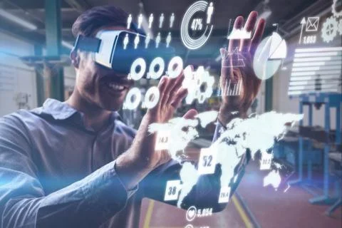 Man using a virtual reality device against workshop Stock Photos