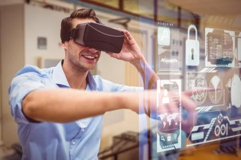 Man using a virtual reality device against workshop Stock Photos