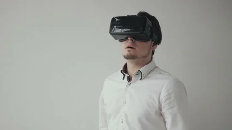 Man Using Virtual Reality Glasses. Special Headset. Isolated on White Bckground Stock Footage 62544802