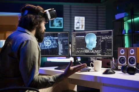 Man using virtual reality goggles talks with conscious AI superintelligence Stock Photos