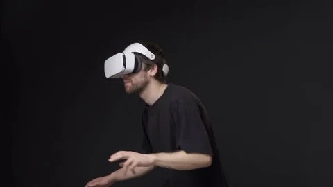 Man using virtual reality headset in the room Stock Footage 75651180