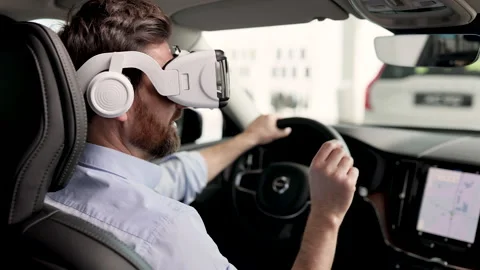 Man using virtual reality headset inside modern car 動画素材 278967789