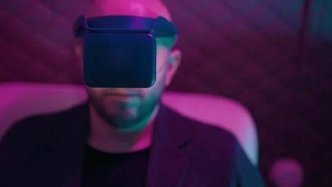 Man using virtual reality headset in neon light Stock Footage 342741018