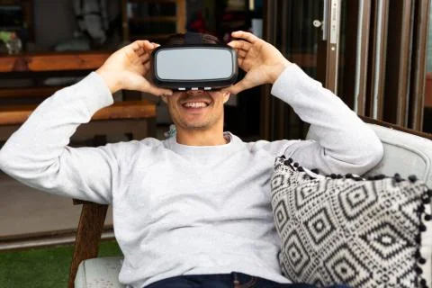 Man using virtual reality headset on a terrace Stock Photos