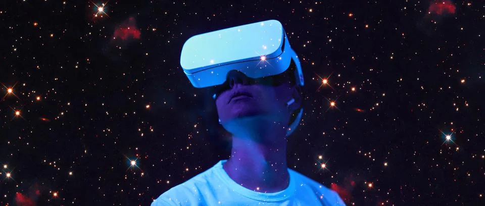 Man is using virtual reality headset. Elements of this image furnished by NASA. Stock Photos