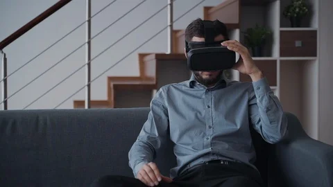 Man using virtual reality helmet or 3d glasses and relaxing at h Stock-Footage 111431705