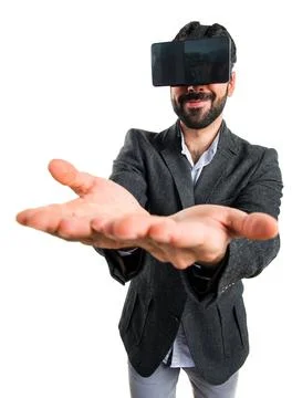 Man using VR glasses holding something Stock Photos