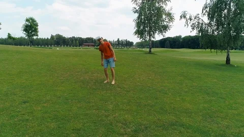 A man using a VR headset and playing a virtual game in the park Stock Footage 114487390