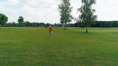 A man using a VR headset and playing a virtual game in the park Stock Footage 114487399