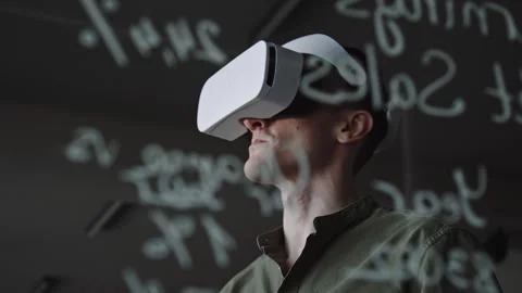 Man Using VR Headset and Remote Controller at Work in Office Stock Footage 275074306