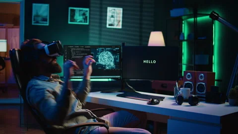 Man using VR headset to do programming scared after AI becoming sentient Stock Footage 266952282