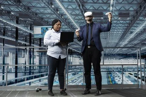 Man using VR headset gear in modern semiconductors factory Stock Photos