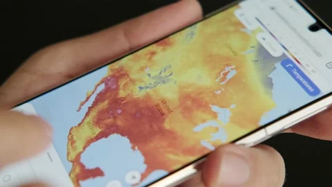 Man using weather forecast app on smartphone. Stock Footage 156729216
