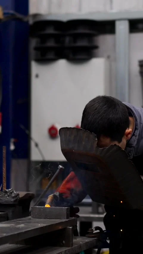 Man using welding machine in a factory Stock Footage 269563309