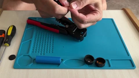 Man Using Wire Strippers on a Gadget Stock Footage 316761865