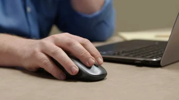 Man in Using Wireles Mouse on Laptop Stock Footage 85637690