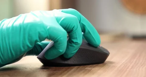 Man using wireless laptop mouse with protective glove close up Stock Footage 133918120