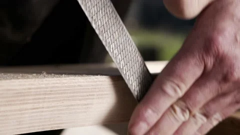 Man Using Wood File on Piece of Timber, Shaping Template Close Up. Stock Footage 220948760