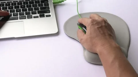Man using wrist rest or support mouse pad while working on computer. Video stock 159789314