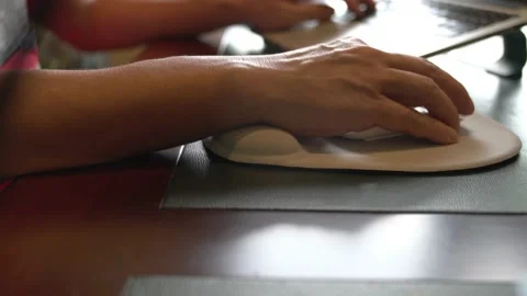 Man using wrist rest or support mouse pad while working on computer. Video stock 159789315