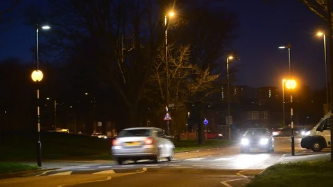 Man using zebra crossing at twilight leeds Yorkshire uk Stock Footage 124204257