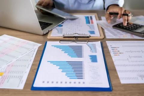 Man Usingcalculator with money stack Financial Report- Business Accounting Co 写真素材