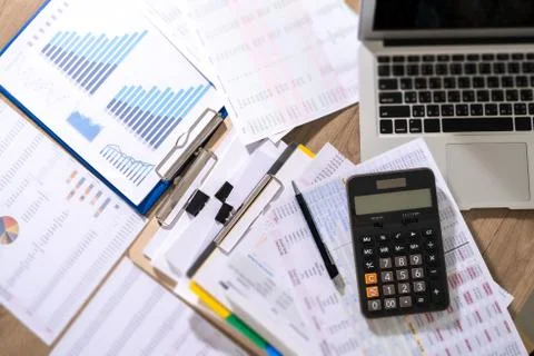 Man Usingcalculator with money stack Financial Report- Business Accounting Co Stock Photos