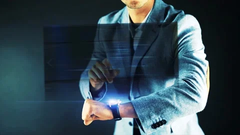 A man utilizing a futuristic interface display looking on a map ending with.. Stock Footage 233690346