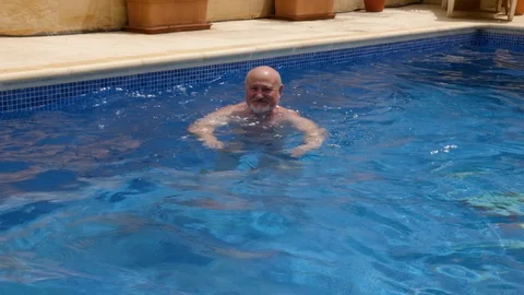 Man on vacation dives in the pool 스톡 동영상 111966495