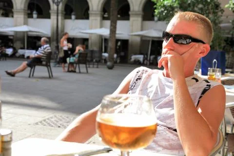 Man on vacation drinking beer Stock Photos