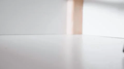 Man vacuum cleaning under the bed storage. Bedroom organization. Small space con Stock Footage 305314401