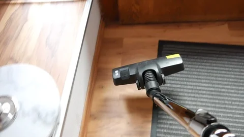 A man vacuuming at the office 库存影片 91680069