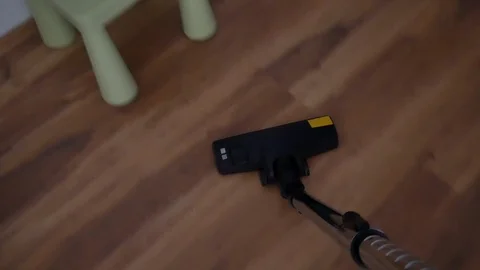 A man vacuuming at the office Stock Footage 91684633