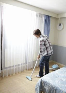Man vacuuming Stock Photos