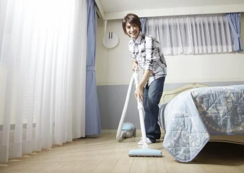 Man vacuuming Stock Photos