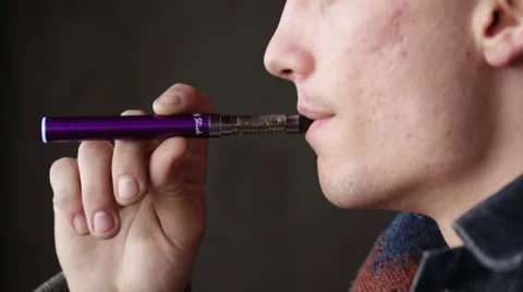 Man Vapes Smokes an E-Cigarette Profile Close Up Jaw Stock Footage 46062220
