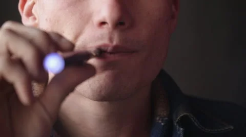 Man Vapes Smokes an E-Cigarette Close Up Jaw Front Stock Footage 46062237
