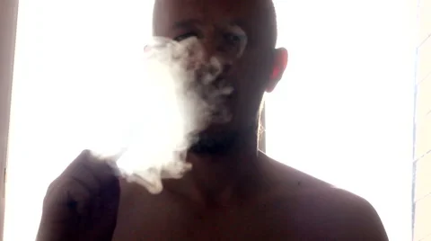 Man vaping e cigarette in the morning, by window Stock Footage 48991680
