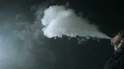 Man vaping with an electronic cigarette and make some smoke clouds (vapor) Stock Footage 62605267