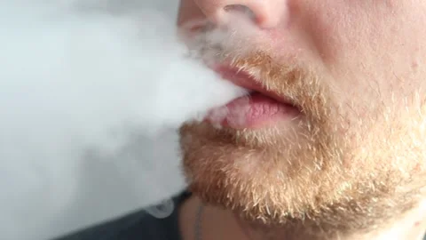 Man vaping electronic cigarette close up Stock Footage 235451241