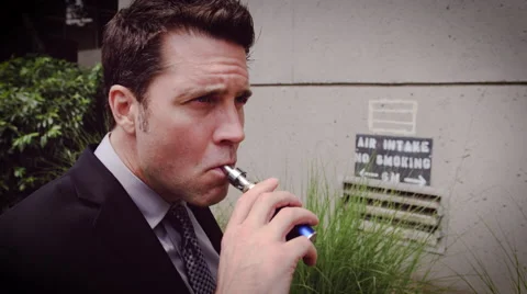 Man vaping electronic cigarette Stock Footage 64455026