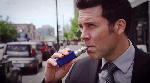 Man vaping electronic cigarette Stock Footage 64475180