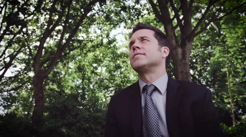 Man vaping electronic cigarette in Park Stock Footage 64454979