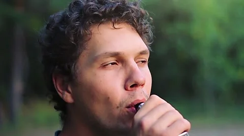 Man vaping in slowmotion Stock Footage 66217753