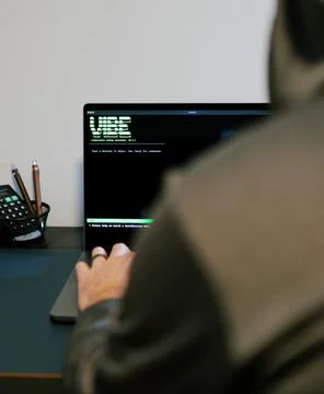 Man Vibe Codes From LLM CLI AI Software Stock Photos