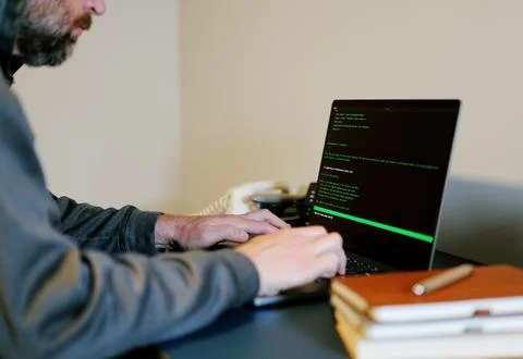 Man Vibe Codes From LLM CLI AI Software Stock Photos