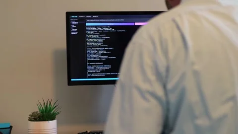 Man Vibe Coding Crypto Coin with AI LLM Tools Stock Footage 322691976