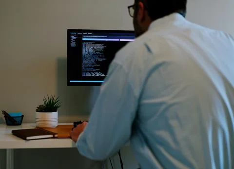 Man Vibe Coding Crypto Coin with AI LLM Tools Stock Photos